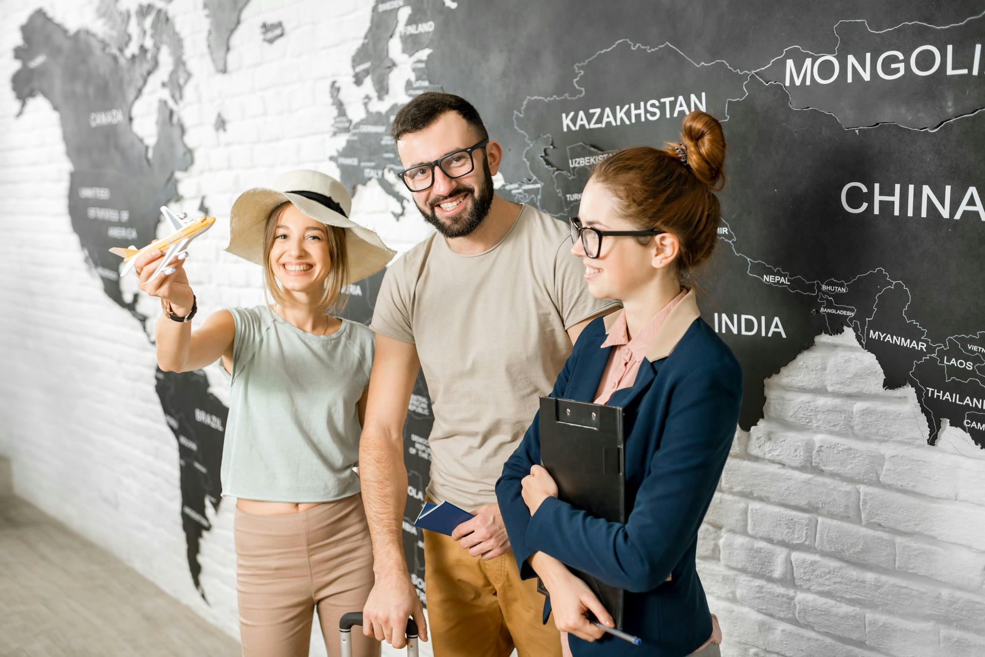 Couple with travel agent at the office